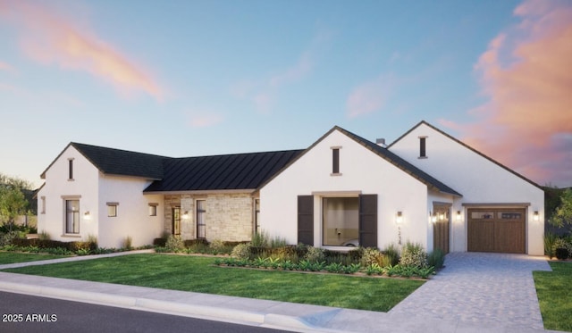 4041 E Mountain View Rd, Phoenix, AZ 85028 - modern farmhouse style home featuring a standing seam roof, a garage, decorative driveway, a yard, and metal roof