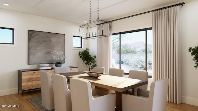 4041 E Mountain View Rd, Phoenix, AZ 85028 - dining area featuring recessed lighting, light wood-type flooring, a mountain view, baseboards, and a chandelier