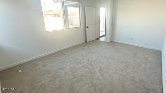 5657 S 253rd Ave, Buckeye, AZ 85326 - spare room with carpet floors and baseboards