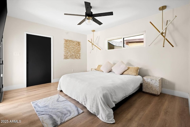 7508 N 13th Ave, Phoenix, AZ 85021 - bedroom featuring wood finished floors, baseboards, and ceiling fan