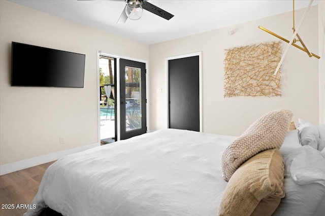 7508 N 13th Ave, Phoenix, AZ 85021 - bedroom featuring access to outside, wood finished floors, a ceiling fan, and baseboards
