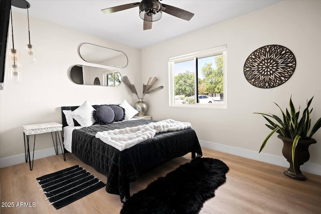 7508 N 13th Ave, Phoenix, AZ 85021 - bedroom featuring wood finished floors, baseboards, and a ceiling fan