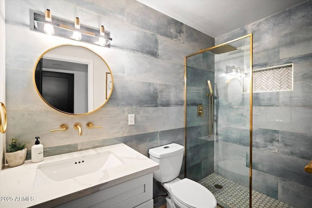 7508 N 13th Ave, Phoenix, AZ 85021 - bathroom featuring tile walls, vanity, tiled shower, and toilet