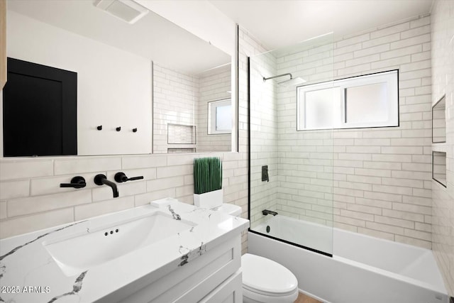 7508 N 13th Ave, Phoenix, AZ 85021 - bathroom with vanity, toilet, tile walls, and shower / bath combination