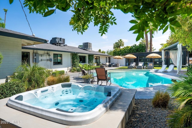 7508 N 13th Ave, Phoenix, AZ 85021 - outdoor pool with an outdoor hot tub, a patio area, central air condition unit, and outdoor dining area