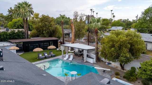 7508 N 13th Ave, Phoenix, AZ 85021 - swimming pool featuring a diving board, outdoor dining space, and a patio area