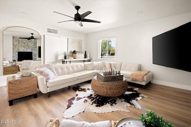 7508 N 13th Ave, Phoenix, AZ 85021 - living room with ceiling fan, wood finished floors, and baseboards