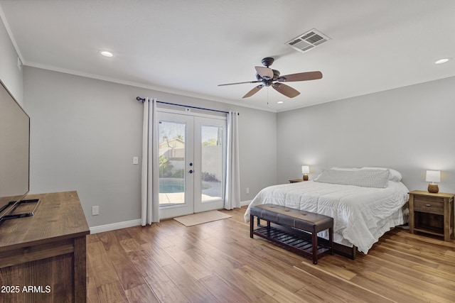 bedroom featuring access to outside, french doors, wood finished floors, baseboards, and ornamental molding