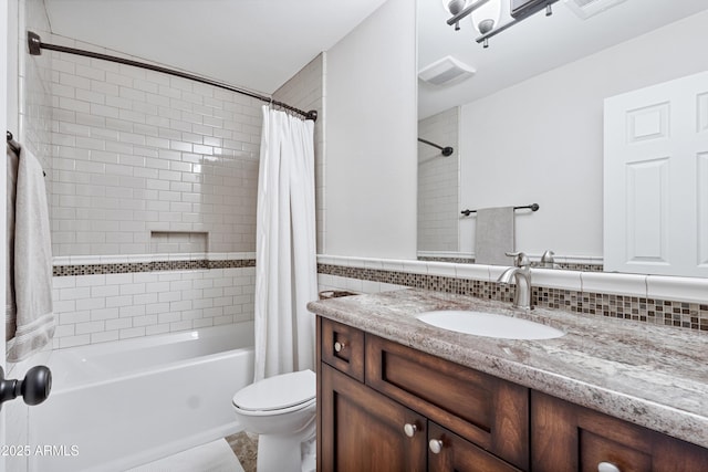 bathroom with toilet, vanity, and shower / bathtub combination with curtain