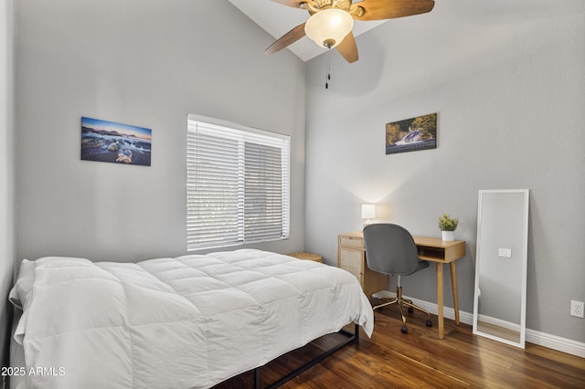 bedroom featuring wood finished floors, baseboards, and a ceiling fan