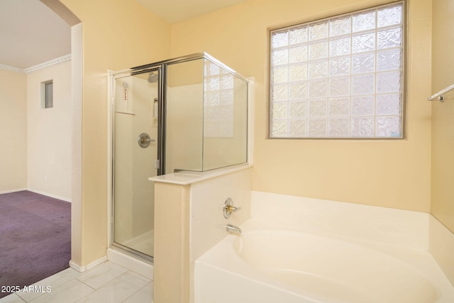 bathroom with shower with separate bathtub