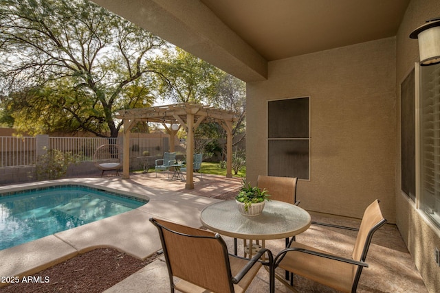 view of pool with a patio and a pergola