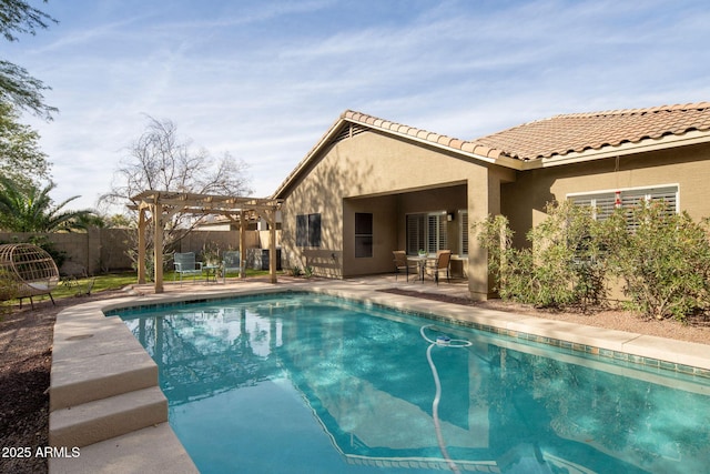 view of swimming pool with a patio and a pergola