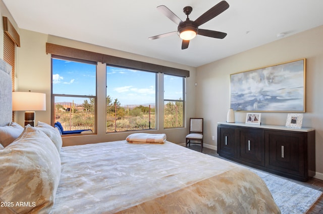 bedroom with ceiling fan and hardwood / wood-style floors