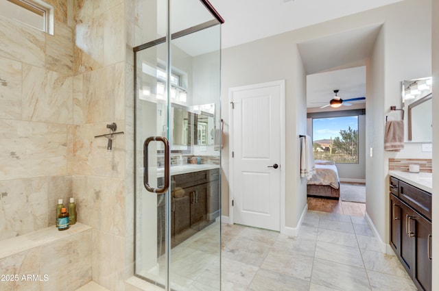 bathroom featuring vanity, ceiling fan, and walk in shower