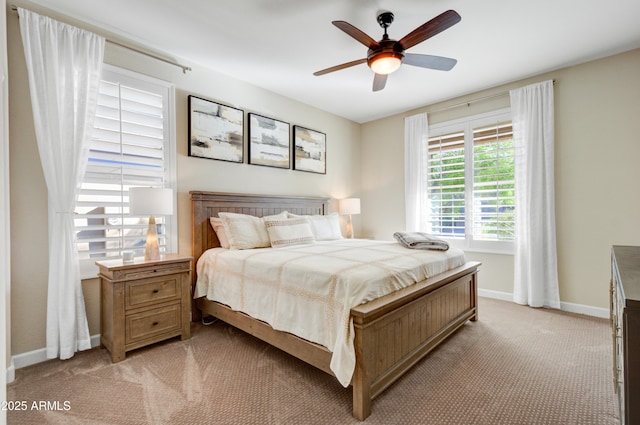 bedroom featuring light carpet and ceiling fan