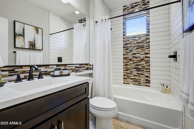 full bathroom featuring toilet, vanity, shower / bathtub combination with curtain, and tasteful backsplash