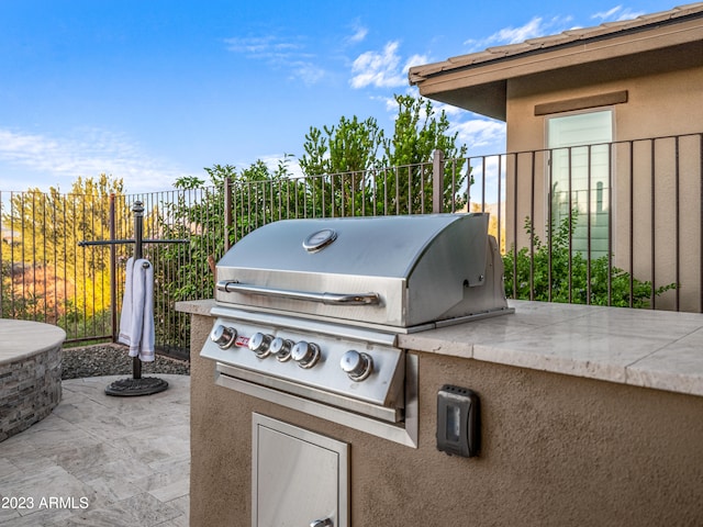 view of patio featuring an outdoor kitchen and area for grilling