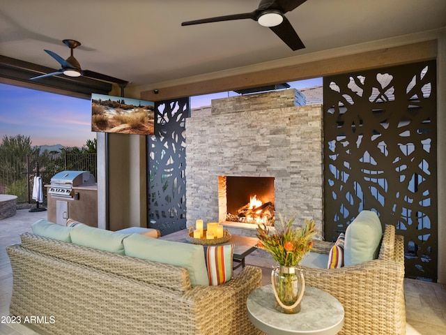 view of patio / terrace featuring area for grilling and an outdoor living space with a fireplace