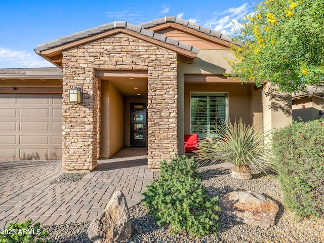 doorway to property featuring a garage