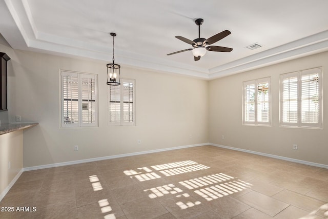 6202 E Mckellips Rd Unit 25, Mesa, AZ 85215 - unfurnished room featuring a tray ceiling, ceiling fan, light tile patterned floors, and baseboards