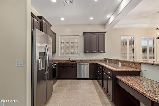 6202 E Mckellips Rd Unit 25, Mesa, AZ 85215 - kitchen featuring appliances with stainless steel finishes, a sink, stone countertops, recessed lighting, and a peninsula