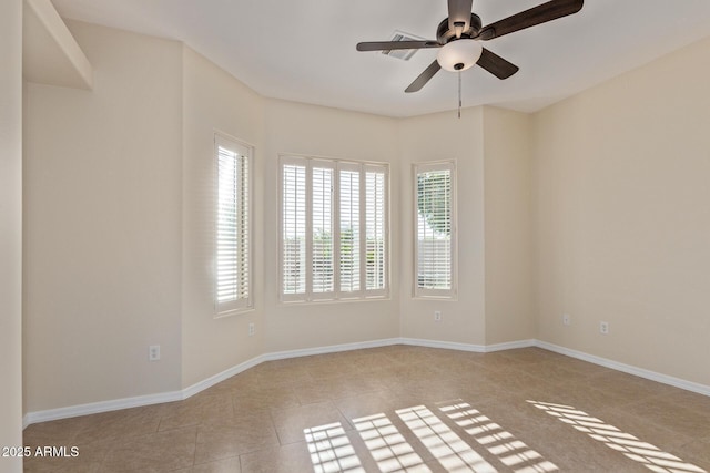 6202 E Mckellips Rd Unit 25, Mesa, AZ 85215 - empty room featuring a ceiling fan, plenty of natural light, and baseboards