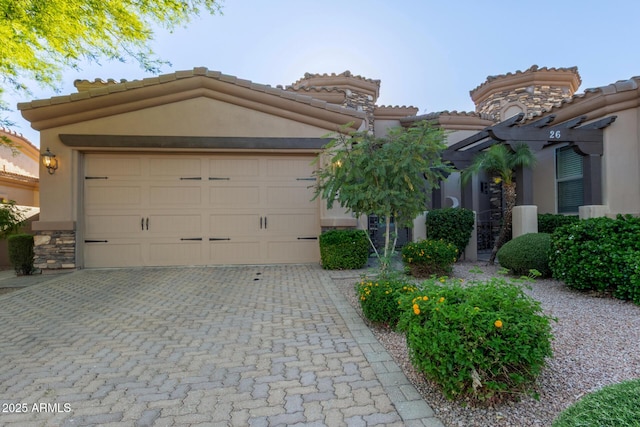 6202 E Mckellips Rd Unit 25, Mesa, AZ 85215 - view of front of property featuring stucco siding, driveway, a tile roof, an attached garage, and stone siding