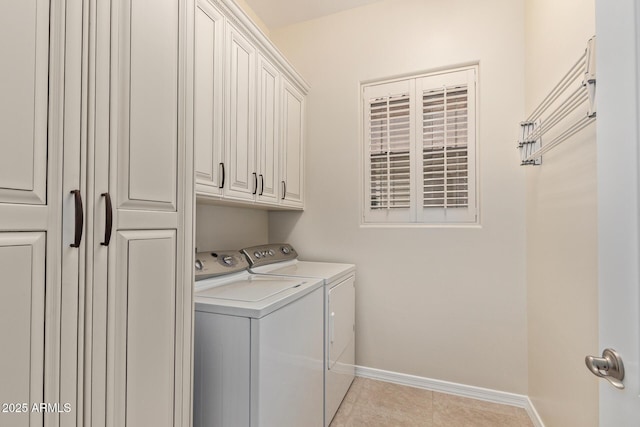 6202 E Mckellips Rd Unit 25, Mesa, AZ 85215 - laundry area featuring washer and dryer, cabinet space, baseboards, and light tile patterned floors