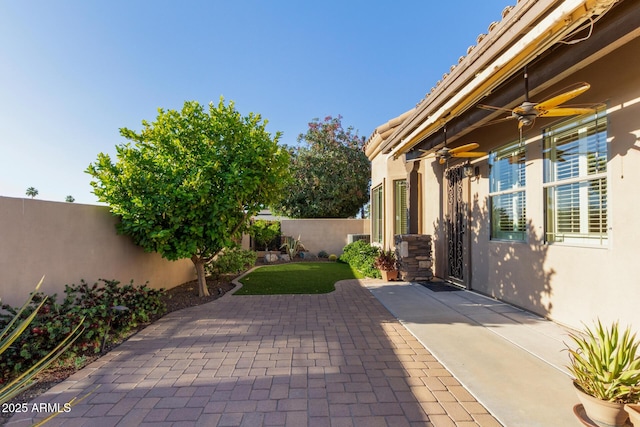 6202 E Mckellips Rd Unit 25, Mesa, AZ 85215 - fenced backyard featuring a ceiling fan and a patio area