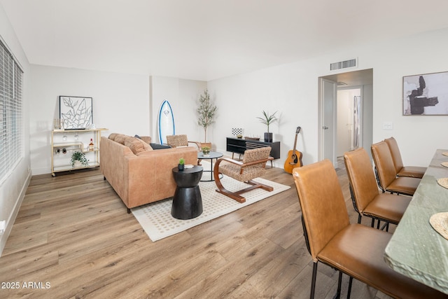 living room with light hardwood / wood-style flooring