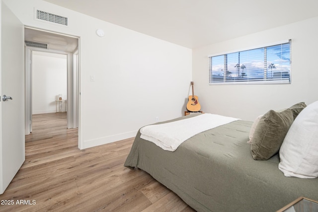 bedroom featuring light wood-type flooring