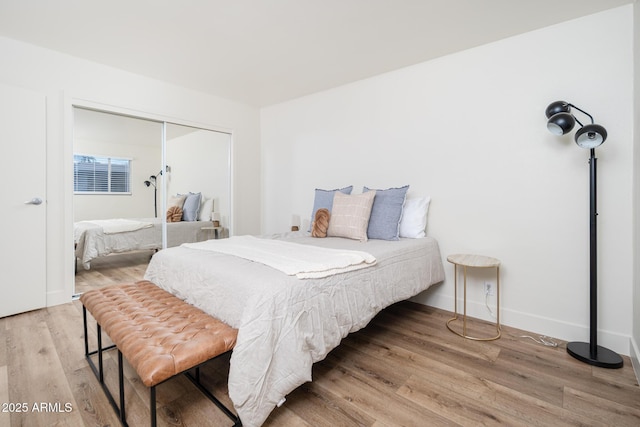 bedroom featuring hardwood / wood-style flooring and a closet