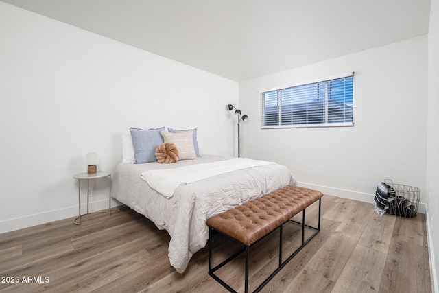 bedroom with light wood-type flooring