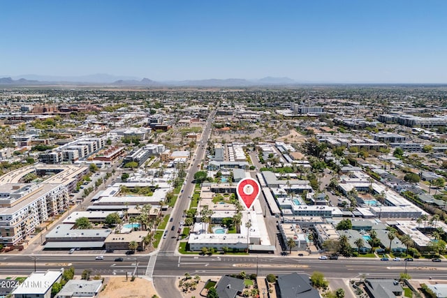 birds eye view of property with a mountain view