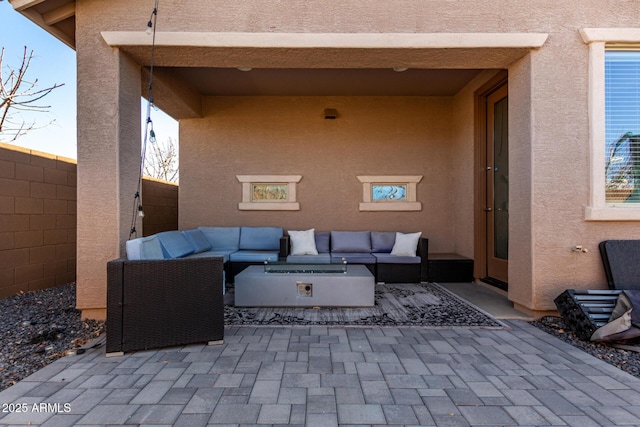 view of patio / terrace with outdoor lounge area and fence