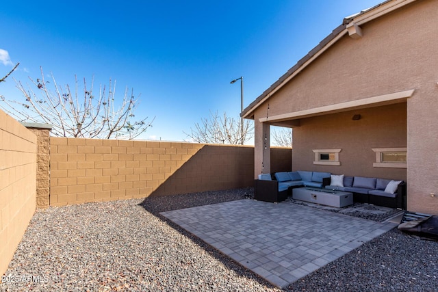 view of patio featuring a fenced backyard and an outdoor hangout area