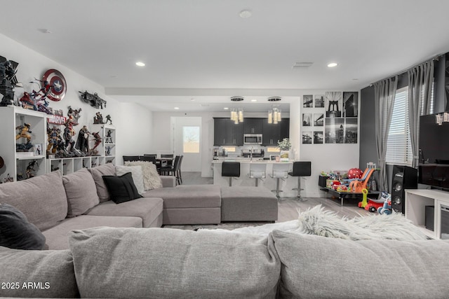 living room with visible vents and recessed lighting