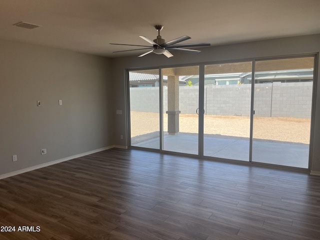 empty room featuring ceiling fan and hardwood / wood-style floors