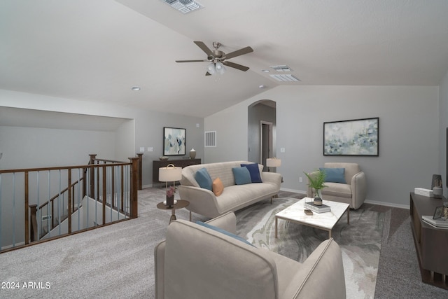 living room with visible vents, arched walkways, lofted ceiling, and a ceiling fan