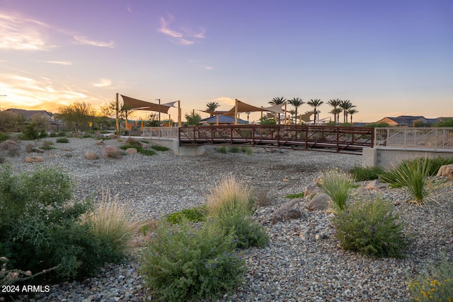 yard at dusk featuring a gazebo