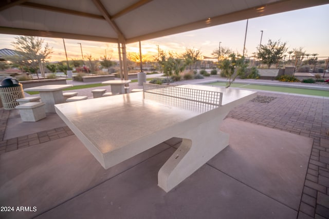 view of patio terrace at dusk