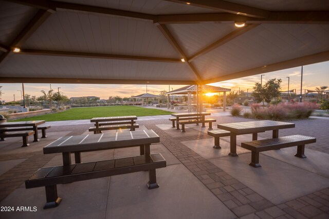 view of community with a gazebo, a yard, and a patio area