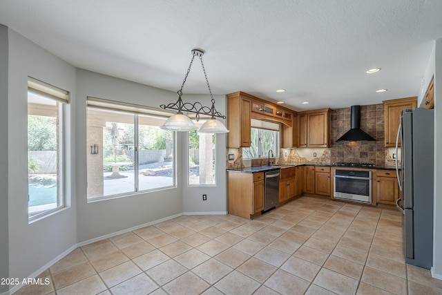 2340 W Myrtle Dr, Chandler, AZ 85248 - kitchen featuring appliances with stainless steel finishes, wall chimney range hood, dark countertops, tasteful backsplash, and healthy amount of natural light