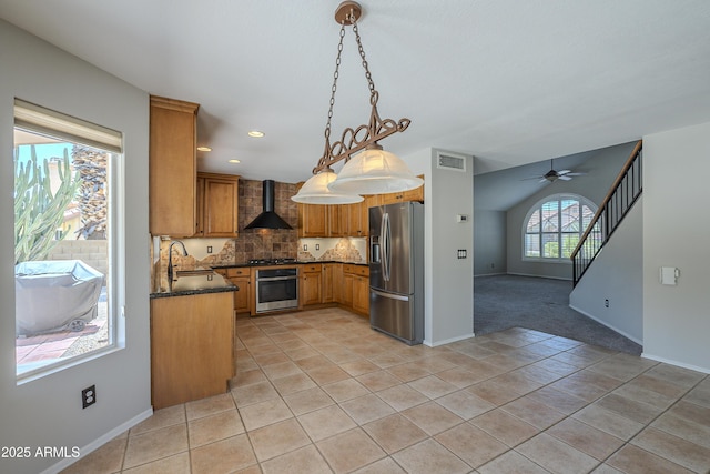 2340 W Myrtle Dr, Chandler, AZ 85248 - kitchen featuring stainless steel appliances, wall chimney range hood, dark countertops, light tile patterned flooring, and decorative backsplash