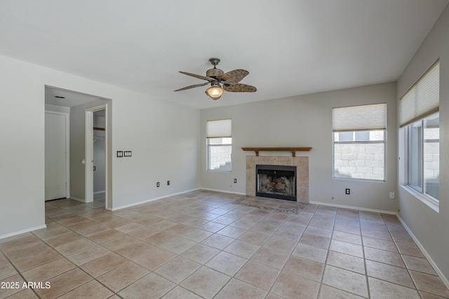 2340 W Myrtle Dr, Chandler, AZ 85248 - unfurnished living room with healthy amount of natural light, ceiling fan, a tile fireplace, and light tile patterned flooring