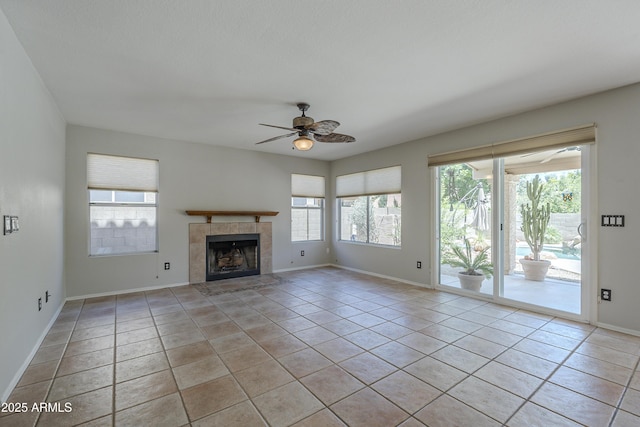 2340 W Myrtle Dr, Chandler, AZ 85248 - unfurnished living room with a ceiling fan, light tile patterned floors, and a tile fireplace