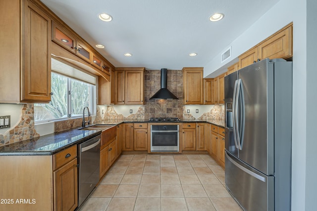 2340 W Myrtle Dr, Chandler, AZ 85248 - kitchen with stainless steel appliances, wall chimney exhaust hood, recessed lighting, dark stone countertops, and light tile patterned floors