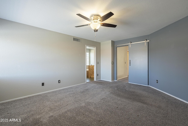 2340 W Myrtle Dr, Chandler, AZ 85248 - unfurnished bedroom featuring carpet floors, ensuite bath, a barn door, and ceiling fan
