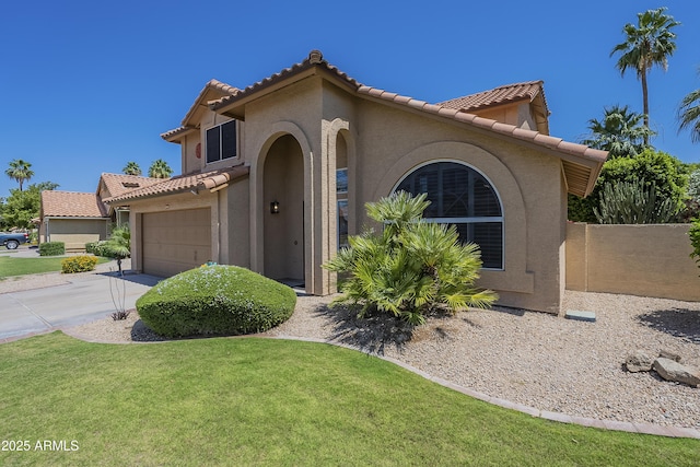 2340 W Myrtle Dr, Chandler, AZ 85248 - mediterranean / spanish-style home featuring stucco siding, a tile roof, concrete driveway, and a front lawn